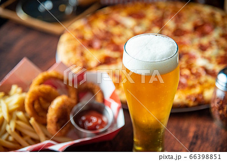 ice cold beer with pizza and french fries ice cold beer with pizza and french fries 66398851