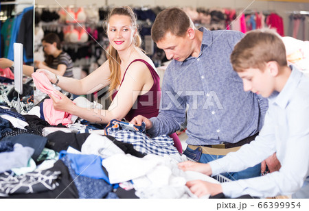 Couple with their son in an underwear store 66399954
