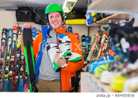 Portrait of client guy in helmet and jacket who is standing with Portrait of client guy in helmet and jacket who is standing with 66400836