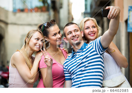 young people taking selfie outdoors . 66402085