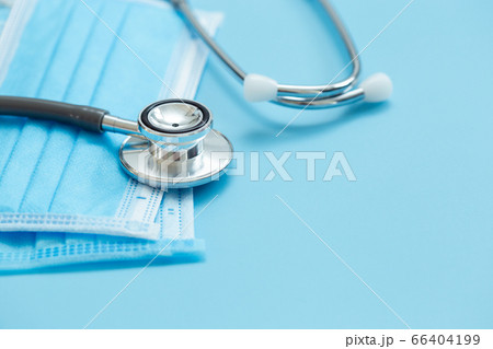 Medical stethoscope and hygiene prevention face mask protection protective virus on blue background. 66404199