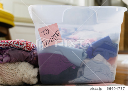 Clothes in bin marked for donation 66404737