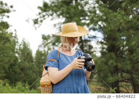 USA, Utah, Bryce Canyon, Woman holding digital camera in national park USA, Utah, Bryce Canyon, Woman holding digital camera in national park 66404822