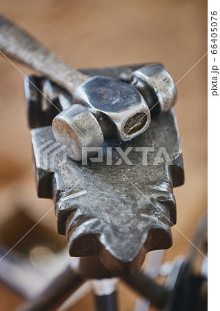 Close up of metal hammer and anvil Close up of metal hammer and anvil 66405076