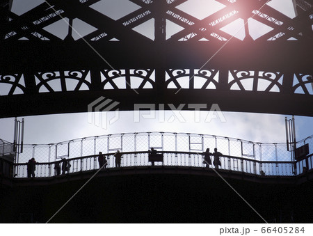 France, Paris, Silhouette of tourists visiting Eiffel Tower 66405284