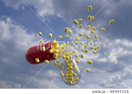 Capsule with yellow pills inside with clouds as background Capsule with yellow pills inside with clouds as background 66405318