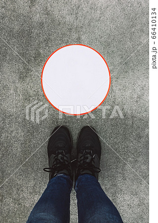 Top view of female legs in sneakers 66410134