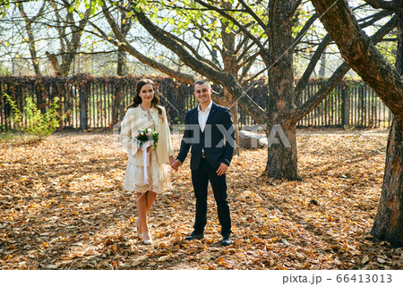 Young male and woman just married. Concept of happy family. Modern family outdoor. Young male and woman just married. Concept of happy family. Modern family outdoor. 66413013