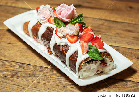 Swiss roll cake with fruit Swiss roll cake with fruit 66419532