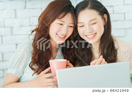 Two woman doing exercise at home Two woman doing exercise at home 66421049