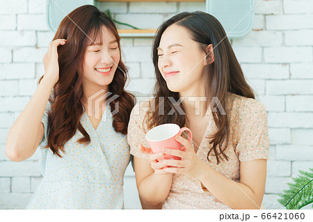 Two woman doing exercise at home Two woman doing exercise at home 66421060