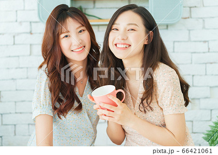 Two woman doing exercise at home 66421061