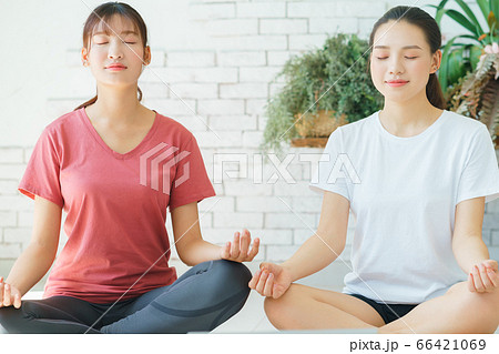 Two woman doing exercise at home Two woman doing exercise at home 66421069