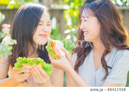Women, eating, nature 66421508