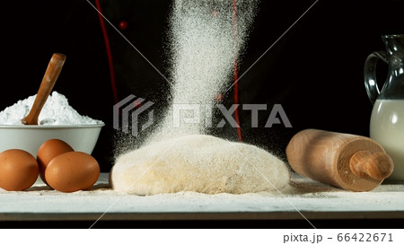 Freeze motion of pouring flour on yeast dough 66422671