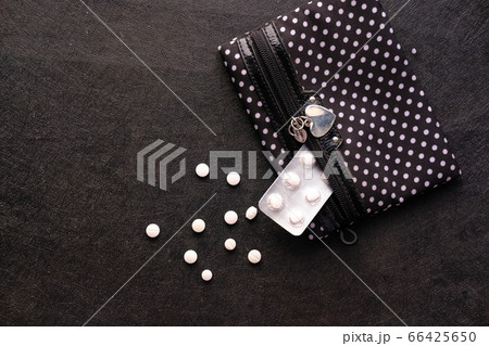 top view of white medicine and blister pack on black background top view of white medicine and blister pack on black background 66425650