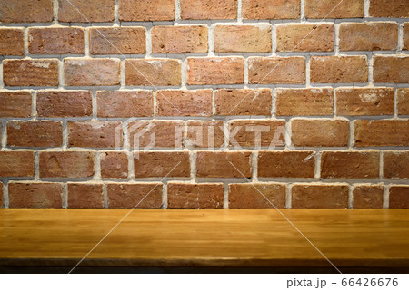 Empty top old wooden table and red brick walls Empty top old wooden table and red brick walls 66426676