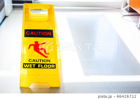 Sign showing warning of caution wet floor on wet 66426712