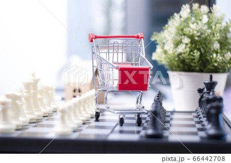 shopping online concept :Shopping Cart onthe box with paper home mock up. Shooping online delivery at home.Work desk blur background.Copyspace for text. nobody.Online Delivery.  66442708