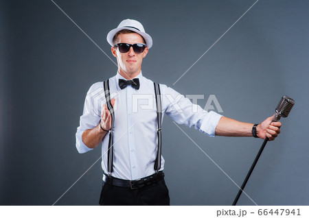 portrait of a man with retro style microphone 66447941