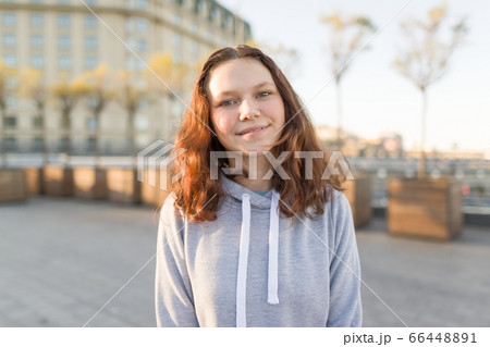 Outdoor portrait of beautiful smiling teenager girl 14, 15 years old 66448891