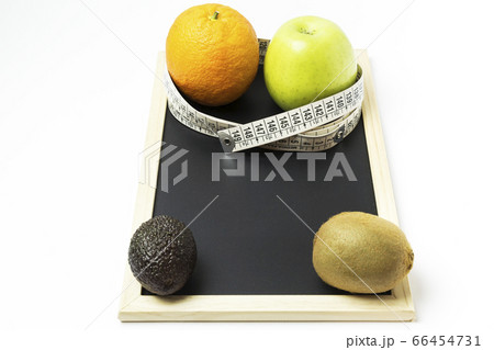 orange, apple, kiwi and avocado surrounded by a orange, apple, kiwi and avocado surrounded by a 66454731