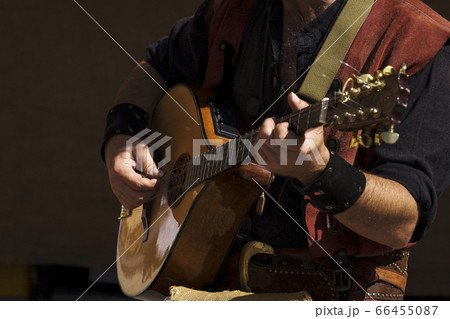 street musician playing street musician playing 66455087
