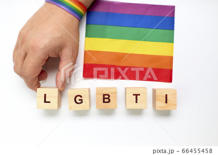 Person with a rainbow bracelet forming with wood Person with a rainbow bracelet forming with wood 66455458