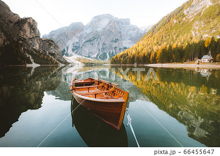Traditional rowing boat on a lake in the Alps in fall Traditional rowing boat on a lake in the Alps in fall 66455647