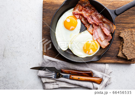 Fried eggs and bacon 66456535