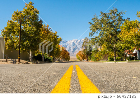 View of an empty street with Black Mountain in the background in Independence, California, USA 66457135