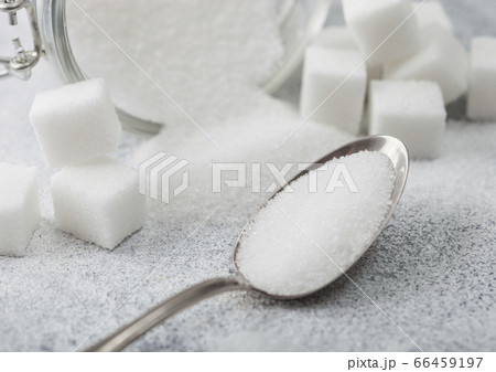 Glass jar of natural white refined sugar with Glass jar of natural white refined sugar with 66459197