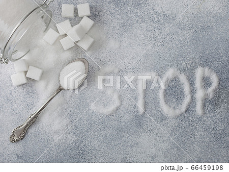 Glass jar of natural white refined sugar with Glass jar of natural white refined sugar with 66459198