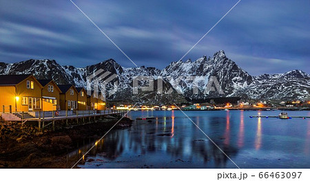 Classic illuminated yellow waterfront rorbu in Ballstad, Lofoten island, Norway Classic illuminated yellow waterfront rorbu in Ballstad, Lofoten island, Norway 66463097