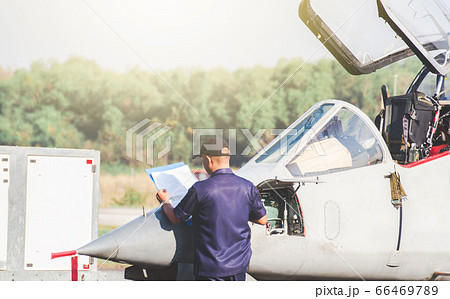 Ground personnel at the airport check of the Ground personnel at the airport check of the 66469789