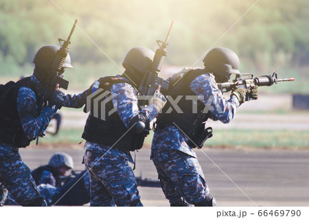 Special Forces soldiers in action. A soldier is 66469790