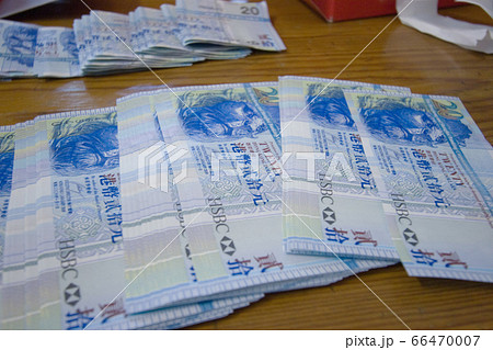 the Pile Of Notes , lying on the wooden table. the Pile Of Notes , lying on the wooden table. 66470007