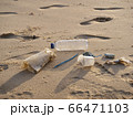 trash on sand beach 66471103