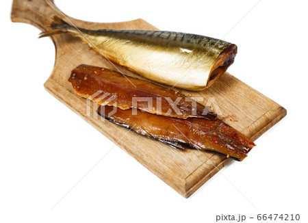 Photo of smoked headless fillet of mackerel on kitchen wooden board Photo of smoked headless fillet of mackerel on kitchen wooden board 66474210