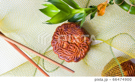 Homemade moon cakes with decorative bamboo and net Homemade moon cakes with decorative bamboo and net 66474900