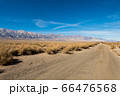 Dirt road and the Sierra Nevada mountain next to the Nikkei concentration camp of Manzanar in Independence 66476568
