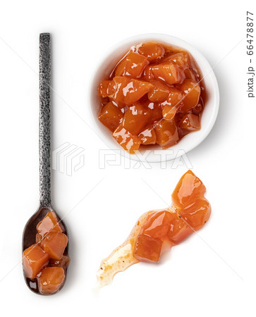 Small glass bowl and spoon of apricot jam Small glass bowl and spoon of apricot jam 66478877