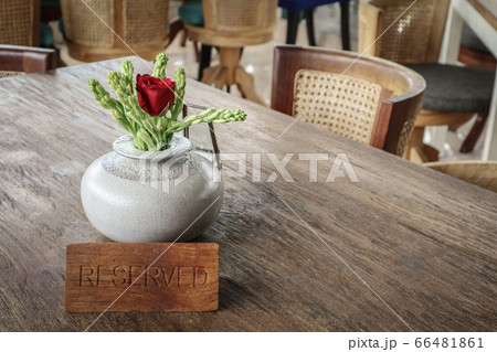 Wooden reserved sign on a  table 66481861