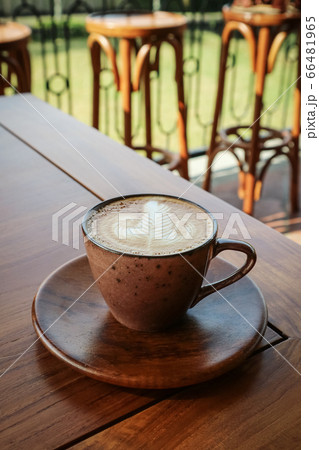 A cup of coffee with latte art on top A cup of coffee with latte art on top 66481965