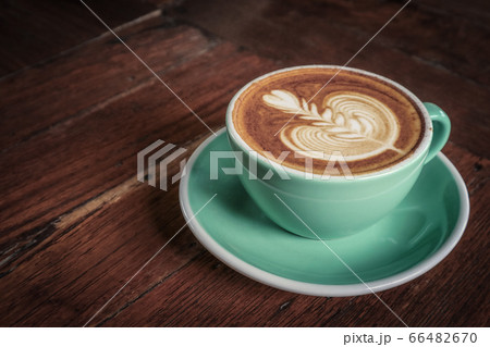 A cup of coffee with latte art on top A cup of coffee with latte art on top 66482670