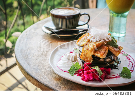 Stack of vegan pancakes and coffee and juice 66482881