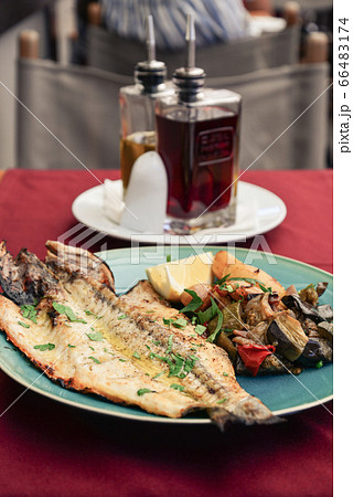 Roasted dorada fish with vegetables Roasted dorada fish with vegetables 66483174