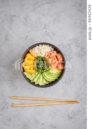 Hawaiian salmon poke bowl with seaweed 66483426
