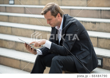 American businessman using digital tablet American businessman using digital tablet 66484790