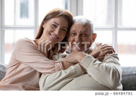 Head shot portrait smiling older father and grownup daughter Head shot portrait smiling older father and grownup daughter 66484791